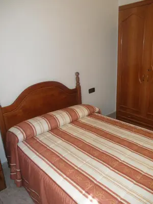 Cama o camas de una habitación en Hostal Los Andes