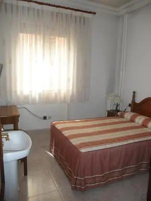 Cama o camas de una habitación en Hostal Los Andes