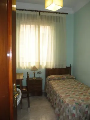 Cama o camas de una habitación en Hostal Los Andes