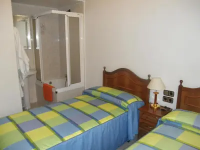 Cama o camas de una habitación en Hostal Los Andes
