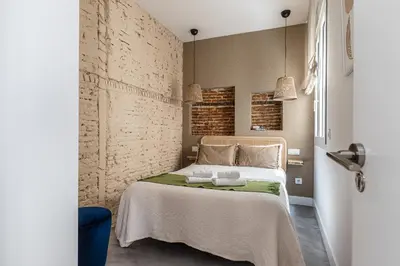 Cama o camas de una habitación en Waou Chueca II - Alquiler Corta Duración