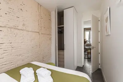 Cama o camas de una habitación en Waou Chueca II - Alquiler Corta Duración