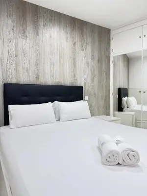 Cama o camas de una habitación en Apartamentos Day Madrid TRIBUNAL
