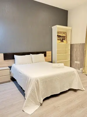 Cama o camas de una habitación en Apartamentos Day Madrid TRIBUNAL