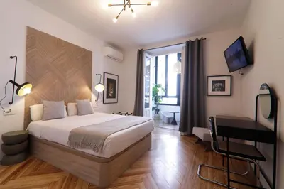 Cama o camas de una habitación en SUITES YOU Gran Vía