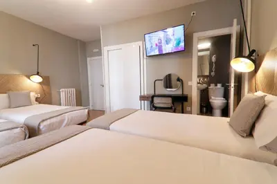 Cama o camas de una habitación en SUITES YOU Gran Vía