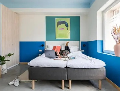 Cama o camas de una habitación en Bob W Madrid Chueca