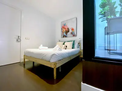 Cama o camas de una habitación en Malasaña Center - Apartamento para 4 en el centro, AC