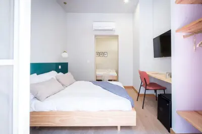 Cama o camas de una habitación en OLBLANC Plaza de España by Batuecas