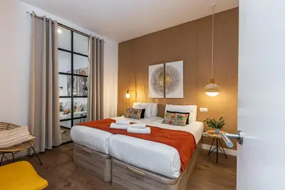 Cama o camas de una habitación en Waou Puerta del Sol V - Alquiler Corta Duración