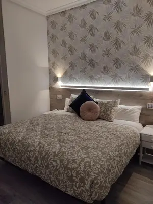 Cama o camas de una habitación en Hostal Alfaro