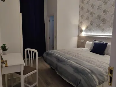 Cama o camas de una habitación en Hostal Alfaro