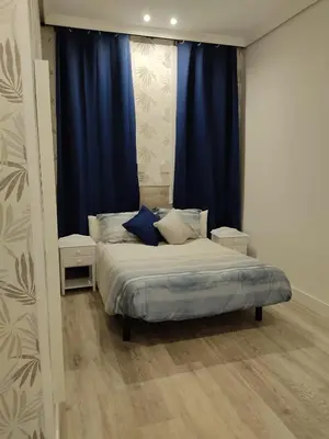 Cama o camas de una habitación en Hostal Alfaro