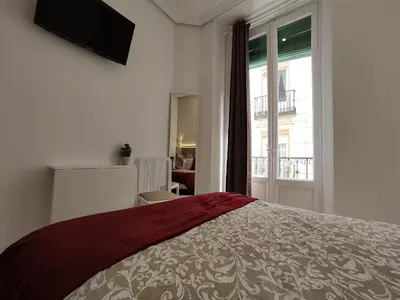 Cama o camas de una habitación en Hostal Alfaro