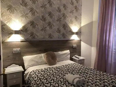 Cama o camas de una habitación en Hostal Alfaro