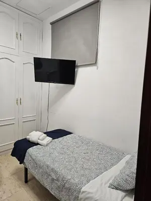 Cama o camas de una habitación en Hostal Alfaro
