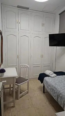 Cama o camas de una habitación en Hostal Alfaro
