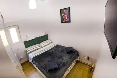 Cama o camas de una habitación en Piso VIP Anton Martin. Madrid Centro.