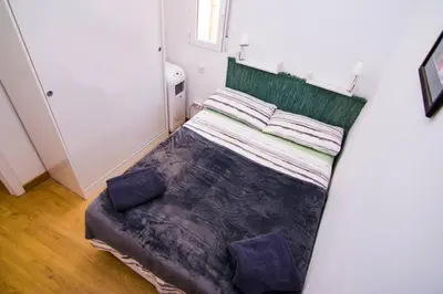 Cama o camas de una habitación en Piso VIP Anton Martin. Madrid Centro.