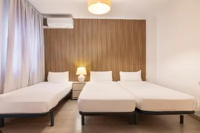 Cama o camas de una habitación en H-A San Mateo Suites