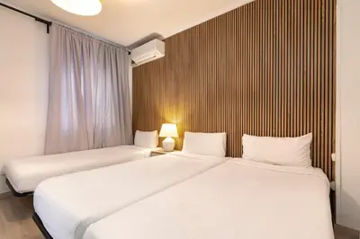 Cama o camas de una habitación en H-A San Mateo Suites