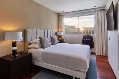 Cama o camas de una habitación en Hyatt Regency Madrid Residences