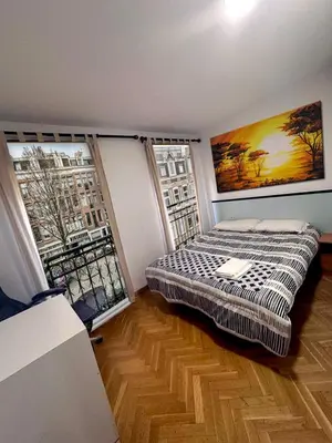 Cama o camas de una habitación en FUENCARRAL BARCELO Apartaments PARKING TPH