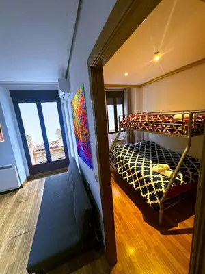 Cama o camas de una habitación en La Reina de Gran Via - PARKING TPH