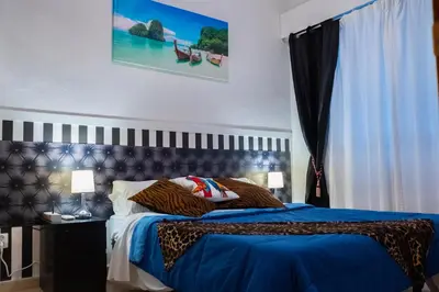 Cama o camas de una habitación en La Reina de Gran Via - PARKING TPH