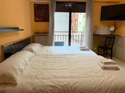 Cama o camas de una habitación en Apartamentos y Estudios Torr en Madrid - Chamartín con Wifi Gratis