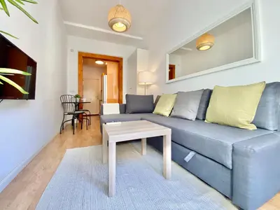 Zona de estar de Valverde Malasaña - Coqueto estudio con sofá cama en el centro