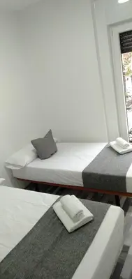 Cama o camas de una habitación en HOSTAL Noche y Dia