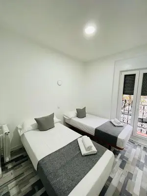 Cama o camas de una habitación en HOSTAL Noche y Dia