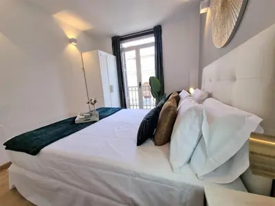Cama o camas de una habitación en Apartamentos San Isidro