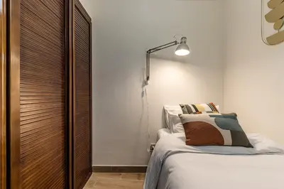 Cama o camas de una habitación en Waou Puerta del Sol III - Alquiler Corta Duración