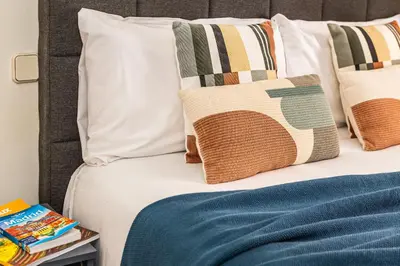 Cama o camas de una habitación en Waou Puerta del Sol III - Alquiler Corta Duración