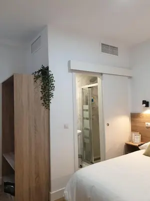 Cama o camas de una habitación en Norte Oviedo Rooms Madrid