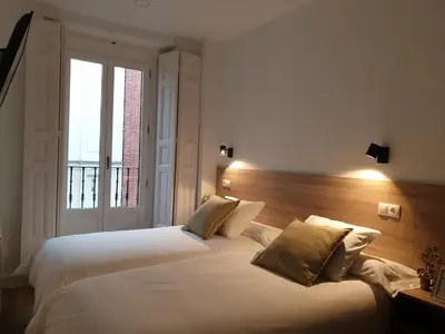Cama o camas de una habitación en Norte Oviedo Rooms Madrid
