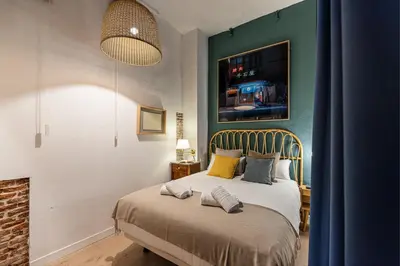 Cama o camas de una habitación en Waou Art Loft La Latina