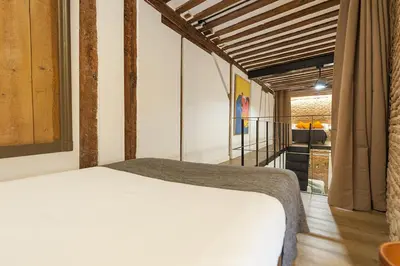 Cama o camas de una habitación en Waou Los Austrias III - Alquiler Corta Duración