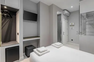 Cama o camas de una habitación en EMBA ROOM