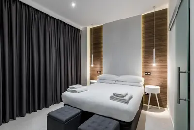 Cama o camas de una habitación en EMBA ROOM