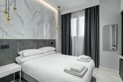 Cama o camas de una habitación en EMBA ROOM