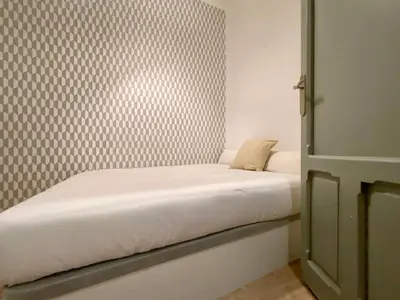 Cama o camas de una habitación en Malasaña Gallery - 3 dormitorios en el Centro