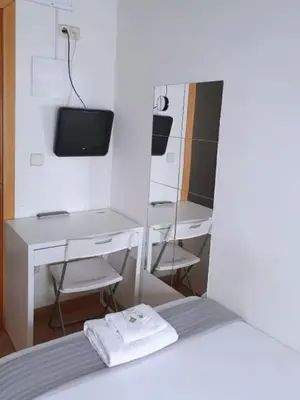 Una televisión o centro de entretenimiento en Apartamentos SmartRenting Tribunal