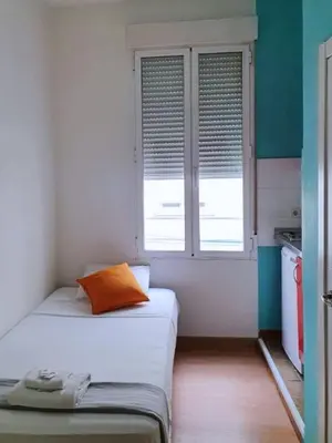 Cama o camas de una habitación en Apartamentos SmartRenting Tribunal