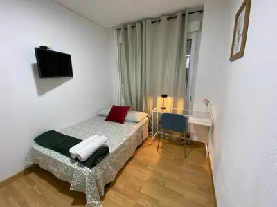 Cama o camas de una habitación en Apartamentos SmartRenting Justicia