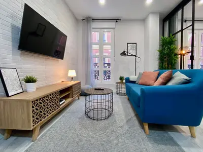 Una televisión o centro de entretenimiento en Madrid Styles - Apartamento de 1 dormitorio