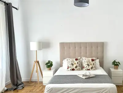 Cama o camas de una habitación en APARTAMENTO 3 HAB MADRID CENTRO