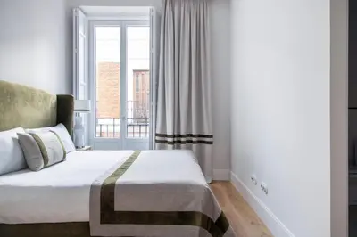 Cama o camas de una habitación en Palacio Tirso de Molina - THE ARC COLLECTION